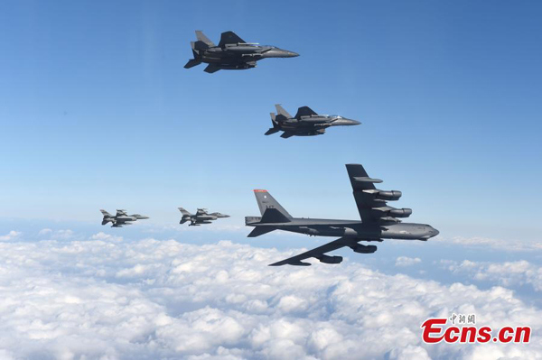 Photo taken on January 10, 2016 shows a U.S. B-52 Stratofortress (bottom R) flying with South Korean F-15K fighter jets (top) and U.S. F-16 fighter jets (bottom L) over South Korea. (Photo/Agencies)