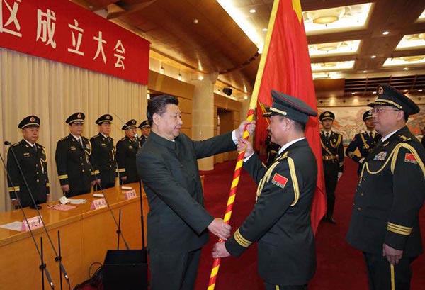 President Xi Jinping (L, front), also general secretary of the Communist Party of China (CPC) Central Committee and chairman of the Central Military Commission, confers a military flag to Commander Liu Yuejun and Political Commissar Zheng Weiping of the Eastern Theater Command in Beijing, capital of China, Feb 1, 2016. (Photo/Xinhua)