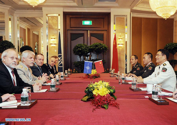 Admiral Sun Jianguo (1st R), deputy chief of the Joint Staff Department of China's Central Military Commission, meets with Chairman of the NATO Military Committee Petr Pavel (2nd L) in Singapore, on June 4, 2016. (Xinhua/Then Chih Wey)