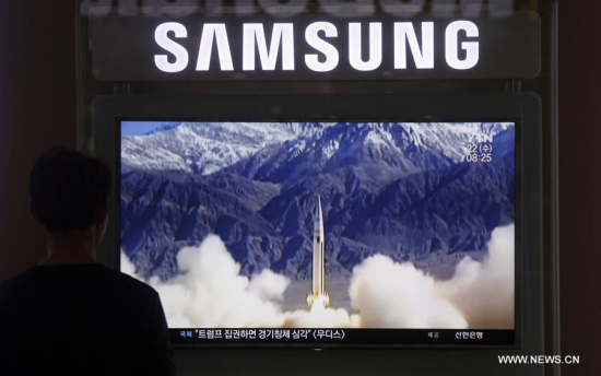 A Local resident watches the screen broadcasting the news that the Democratic People's Republic of Korea (DPRK) fired a missile, at a train station in Seoul, South Korea, June 22, 2016. (Xinhua/Yao Qilin)