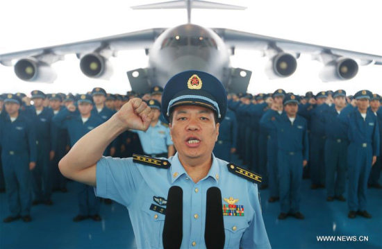 Chen Gang (front), a division commander of the People's Liberation Army (PLA) Air Force, takes the oath during the hand over ceremony of the Y-20, China's homegrown large transport aircraft, in Chengdu, capital of southwest China's Sichuan Province, July 6, 2016. (Xinhua/Liu Yinghua)