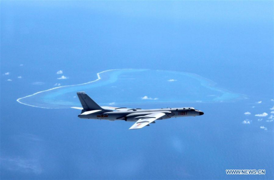 Undated photo shows a Chinese H-6K bomber patrolling islands and reefs including Huangyan Dao in the South China Sea. The People's Liberation Army (PLA) Air Force conducted a combat air patrol in the South China Sea recently, which will become a regular practice in the future, said a military spokesperson on July 18, 2016. (Xinhua/Liu Rui)