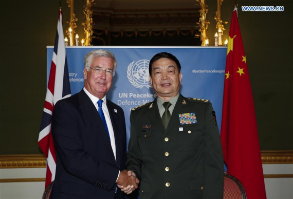 Chinese Defense Minister Chang Wanquan (R) meets with British Secretary of State for Defense Michael Fallon on the sideline of the UN peacekeeping defense ministerial meeting in London, Britain, Sept. 8, 2016. (Photo: Xinhua/Han Yan)