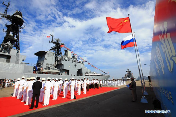 Officers and soldiers of Chinese Navy hold a welcome ceremony as a Russian fleet arrive at a port in Zhanjiang, south China's Guangdong Province, Sept. 12, 2016.  (Photo: Xinhua/Zha Chunming)