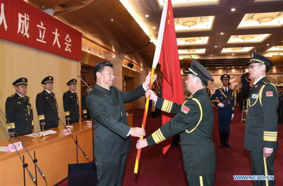 Chinese President Xi Jinping(L, front), also general secretary of the Communist Party of China (CPC) Central Committee and chairman of the Central Military Commission (CMC), confers a military flag to Commander Li Shisheng and Political Commissar Yin Zhihong of Wuhan Joint Logistics Unit as the CMC established a joint logistics support force in Beijing, capital of China, Sept. 13, 2016. (Photo: Xinhua/Li Gang)