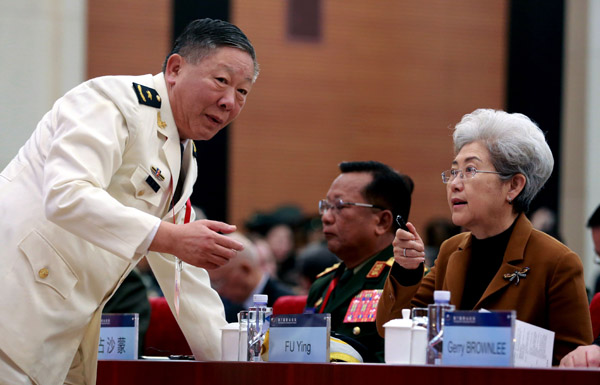 Fu Ying (right), foreign affairs chief of China's top legislature, talks with Guan Youfei, in charge of international military cooperation, on Tuesday at the Xiangshan Forum. (Photo by FENG YONGBIN/CHINA DAILY)
