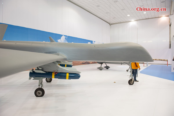 A prototype of CH-5 carrying AR-1 air-to-surface missiles, is on display at the CAAA exhibition center on Oct. 25, 2016. (Photo/China.org.cn)