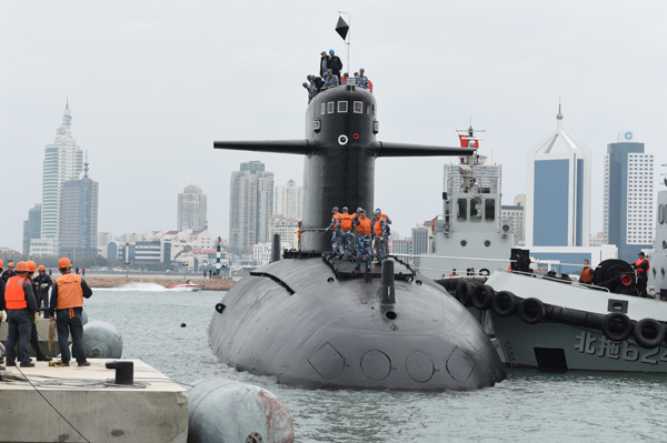 A nuclear-powered submarine is berthed at a port of the Chinese Navy Museum in Qingdao, Shandong province, on Oct 15. The vessel will be displayed at the museum soon. (Photo by Lai Yonglei / For China Daily)