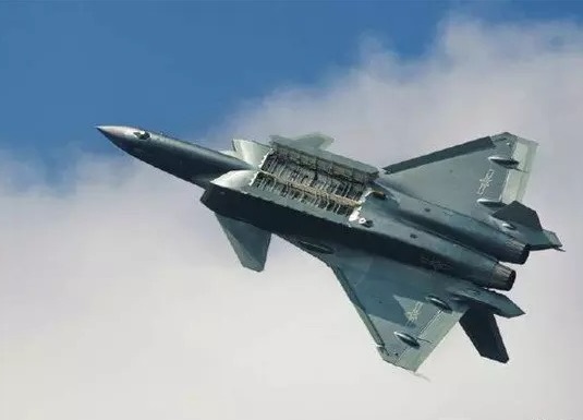 China's 5th-generation J-20 fighter is seen flying with weapons bay open during a test flight. (File photo/People's Daily Online)