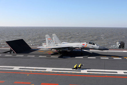Several batches of J-15 carrier-based aircraft, carrying live ammunition, are performing strike exercises in a drill conducted by the Chinese Navy. (Photo/CRIENGLISH.com)