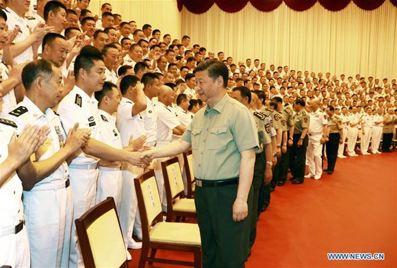 Chinese President Xi Jinping (R, front), who is also general secretary of the Communist Party of China (CPC) Central Committee and chairman of the Central Military Commission, shakes hands with delegates to the 12th Party congress of the People's Liberation Army (PLA) Navy, during an inspection of the PLA Navy headquarters, in Beijing, capital of China, May 24, 2017. (Xinhua/Zha Chunming)