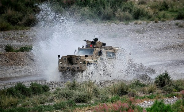 An armored vehicle takes part in a joint anti-terrorism drill conducted by Chinese and Kyrgyz border defense troops in Artux, Xinjiang Uygur autonomous region, on June 27, 2017. (Photo by Zhang Zheng/chinadaily.com.cn)