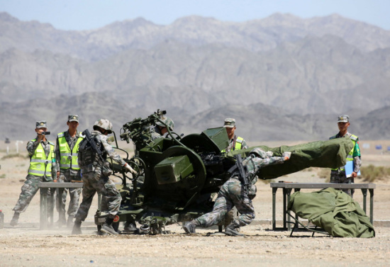 Chinese soldiers perform maintenance on an anti-aircraft artillery gun during the Gunsmith Master event of the International Army Games (IAG) 2017 on August 7, 2017. (Photo/chinamil.com.cn)