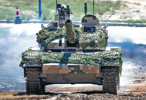 The VT-5 light-duty tank is put through its paces at a demonstration held on Wednesday by State-owned arms-maker China North Industries Group Corp. Provided to China Daily