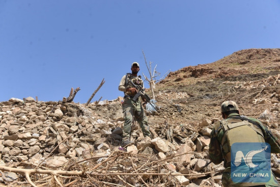 File photo: Afghan army soldiers inspect at the site of a U.S. bombing in Achin district of Nangarhar province, Afghanistan, April 28, 2017. (Xinhua/Rahman Safi)