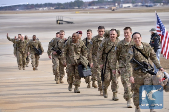 File Photo: Paratroopers from the XVIII Airborne Corps headquarters returned from Afghanistan arrive at Green Ramp at Fort Bragg, North Carolina, the United States, Dec. 5, 2014. (Xinhua/Yin Bogu)