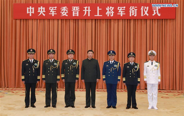 Xi Jinping (C), chairman of the Central Military Commission (CMC), poses for a group photo with Zhang Shengmin (1st L), secretary of CMC discipline inspection commission, after a promotion ceremony in Beijing, capital of China, Nov. 2, 2017. The Central Military Commission (CMC) on Thursday promoted Zhang Shengmin to the rank of general, the highest rank for officers on active service in China. (Xinhua/Li Gang)