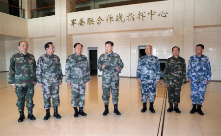Chinese President Xi Jinping (C), who is also general secretary of the Communist Party of China Central Committee and chairman of the Central Military Commission (CMC) and commander in chief of the CMC joint battle command center, inspects the command center with other members of the CMC on Nov. 3, 2017. Xi Jinping on Friday instructed the armed forces to improve their combat capability and readiness for war. (Xinhua/Li Gang)