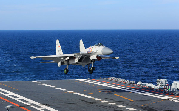 A J-15 fighter jet lands on CNS Liaoning in July. (Photo/Xinhua)