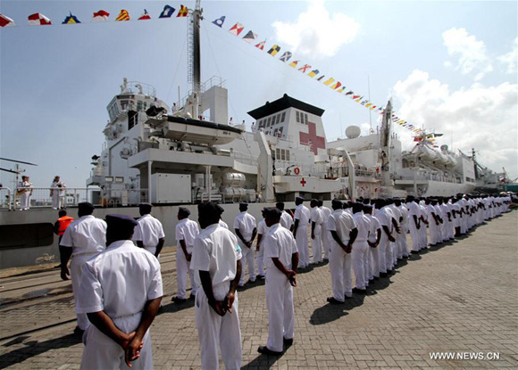 Tanzania Navy Commander Richard Mutayoba Makanzo inspects Chinese navy soldiers on the Chinese naval hospital ship Peace Ark at Dar es Salaam Port in Dar es Salaam, Tanzania, on Nov. 19, 2017. Chinese naval hospital ship Peace Ark arrived on Sunday morning in Tanzania's Dar es Salaam, starting an eight-day humanitarian mission of providing free medical services to local residents. (Xinhua)