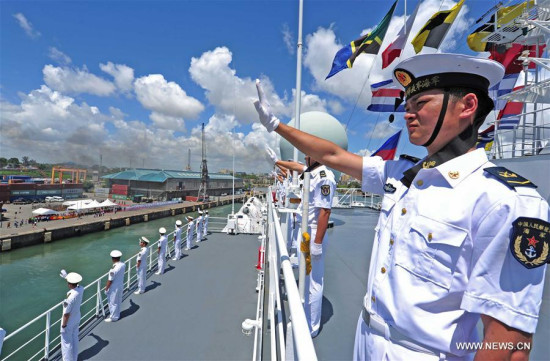 Tanzanian President John Magufuli (3rd R, front) inspects the guards of honor aboard Chinese hospital ship Peace Ark in Dar es Salaam, Tanzania, on Nov. 26, 2017. (Xinhua/Jiang Shan)