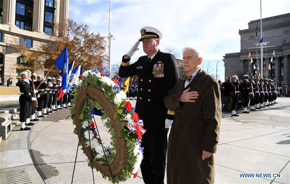 Robert Kaufman (R), the living American on board the USS Missouri witnessing Japan's surrender during World War II, attends the 76th Commemoration on Pearl Harbor Attack at the Navy Memorial Plaza in Washington D.C., the Unite States, on Dec. 7, 2017.  (Xinhua/Yin Bogu)