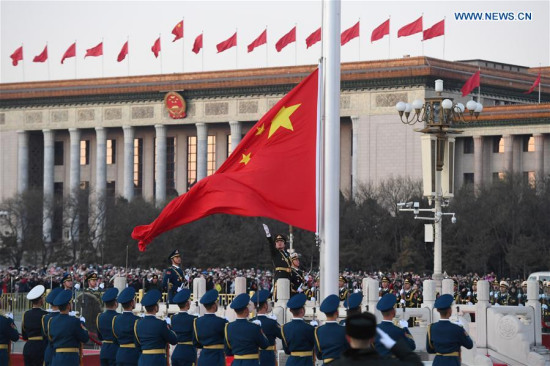 The Guard of Honor of the Chinese People's Liberation Army (PLA) perform the national flag-raising duty at the Tian'anmen Square in Beijing, capital of China, Jan. 1, 2018. (Xinhua/Shen Hong) 