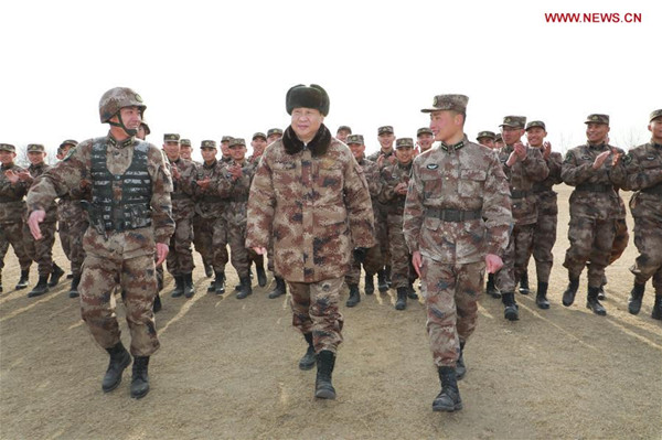 Chinese President Xi Jinping (C, front), also general secretary of the Communist Party of China Central Committee and chairman of the Central Military Commission, talks with officers and soldiers during an inspection of a division of the People's Liberation Army (PLA) army in the Central Theater Command on Jan. 3, 2018. (Xinhua/Li Gang)