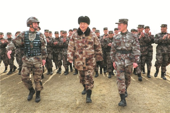 President Xi Jinping, also the chairman of the Central Military Commission, inspects a Ground Force division from the Central Theater Command of the People's Liberation Army on Thursday. Xi climbed aboard modern military hardware such as the Type 99A tank as part of the inspection. (Photo: Xinhua/Li Gang)