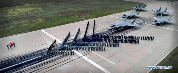 An undated file photo shows pilots of J-16 and J-20 fighters taking an oath together. China's latest J-20 stealth fighters have been commissioned into air force combat service, a spokesperson confirmed Friday. (Xinhua)