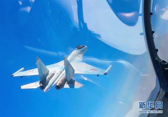 This undated photo shows a fighter jet takes part in a joint combat patrol mission in the South China Sea area. (Photo/Xinhua) 