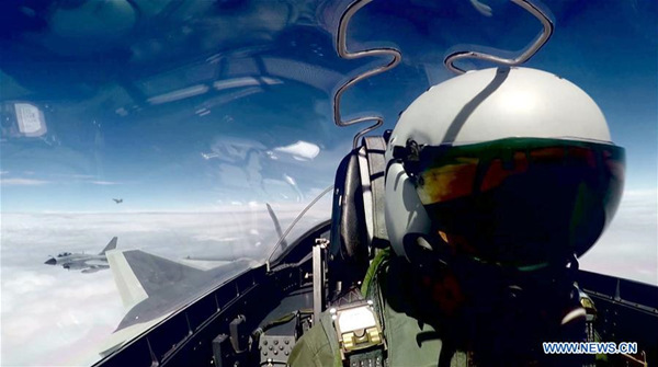 Undated file photo shows China's J-20 stealth fighter jets taking part in their first-ever combat training over the ocean. China's J-20 stealth fighter jets have begun their first-ever combat training over the ocean, a spokesperson confirmed Wednesday. The J-20 is China's fourth-generation medium and long-range fighter aircraft and was commissioned into air force combat service earlier this year. (Xinhua)