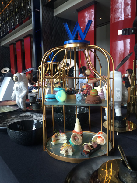 The cosmic afternoon tea set for one is displayed at the lobby lounge of W Beijing Chang'An during a media preview, on June 29, 2016. The three-month themed afternoon tea is available from July 1. (Photo by Jiang Wanjuan/chinadaily.com.cn)
