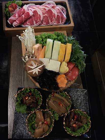 The newly opened CouCou in Beijing offers hotpot and tea culture elements of a medium to high end range.(Photo provided to China Daily)