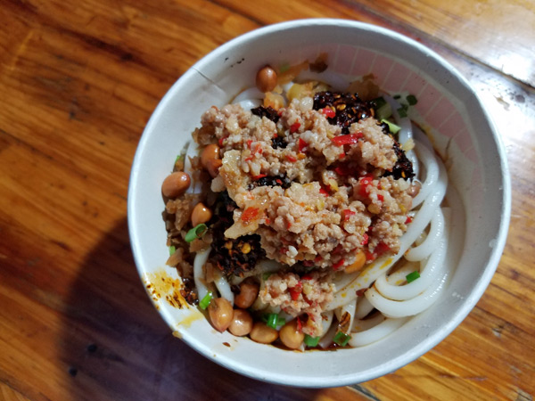 Roumo Pepper Rice Noodle, which costs 6.5 yuan, is packed with chillies and pickles. (Photo by Faisal Kidwai)