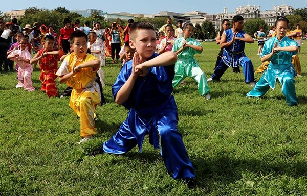 Martial arts teams from the US perform near the White House in Washington, DC, during the Super Flash Mob celebration marking the 2016 China-U.S. Tourism Year. (Photo by Cai Chunying/China Daily)