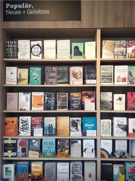 The shelf of best-selling books and new arrivals at Ocelot bookstore, Berlin. MEI JIA/CHINA DAILY