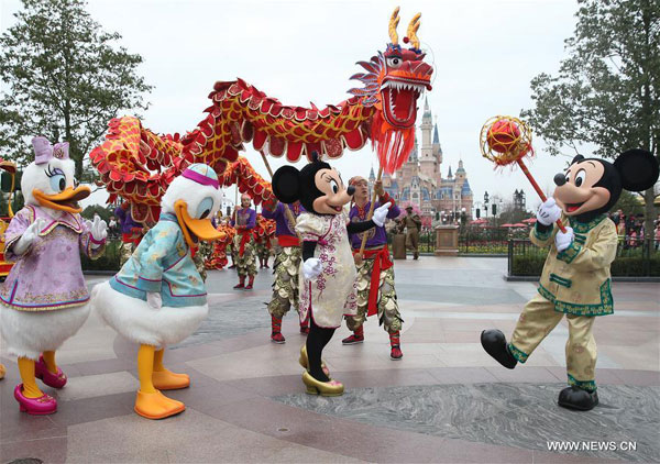 Cartoon characters join in the Chinese traditional dragon dance in Shanghai Disney Resort in Shanghai, east China, Jan. 11, 2017. As the Spring Festival approaches, Chinese traditional elements were added to the activities at Shanghai Disney Resort. (Photo/Xinhua)