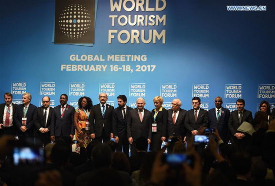 Delegates pose for a photograph at the World Tourism Forum Global Meeting in Istanbul, Turkey, on Feb. 16, 2017. (Xinhua/He Canling)