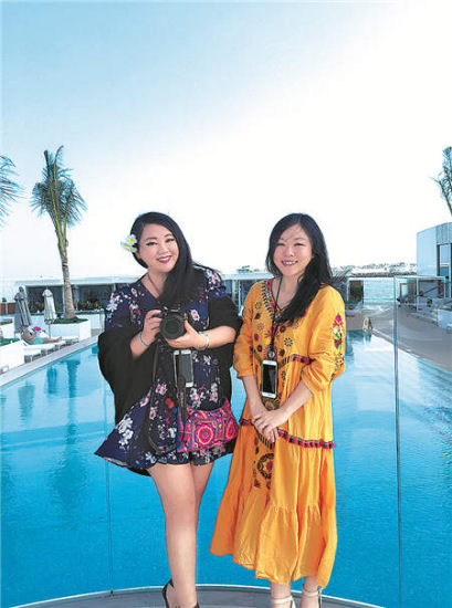 Zhang Jin (left) and Pang Qianyi, at Burj al-Arab Hotel, Dubai, United Arab Emirates.