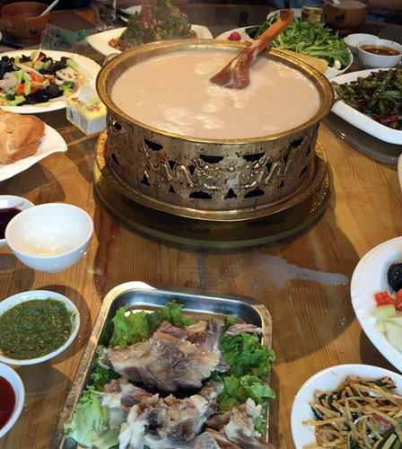 A bowl of Mongolian milk tea is the centerpiece of the lunch table. (Photo/Courtesy of Brian Salter)