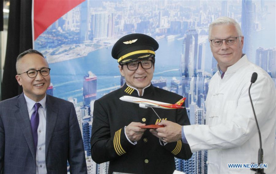 China's Hong Kong Airlines official George Liu (L), superstar Jackie Chan (C) and Craig Richmond, president and CEO of Vancouver International Airport, attend a ceremony at the Vancouver International Airport in Vancouver, Canada, June 30, 2017. (Xinhua/Liang Sen)