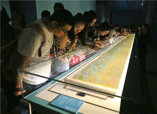 Treasures on show at the Palace Museum in Beijing include the early 12th-century masterpiece, A Panorama of Rivers and Mountains, and ancient clay figurines. (Photo by Jiang Dong/China Daily)