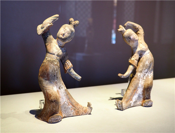 Treasures on show at the Palace Museum in Beijing include the early 12th-century masterpiece, A Panorama of Rivers and Mountains, and ancient clay figurines. (Photo by Jiang Dong/China Daily)