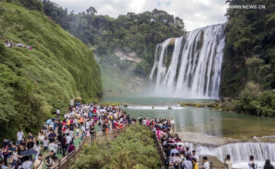 Tourists visit the Huangguoshu Waterfall in Anshun City, southwest China's Guizhou Province, Oct. 2, 2017. (Xinhua/Chen Xi)