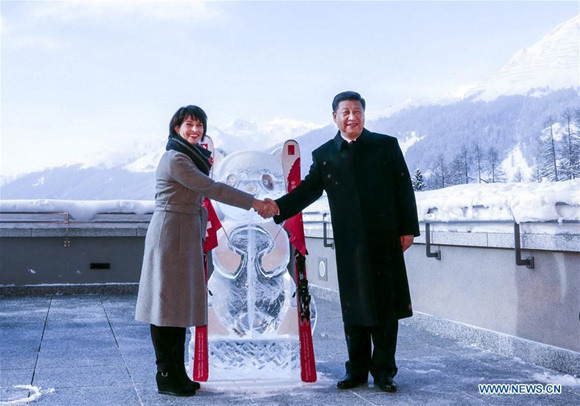Chinese President Xi Jinping (R) and his Swiss counterpart Doris Leuthard pose for photos during a launching ceremony of the China-Switzerland Year of Tourism in Davos, Switzerland, Jan. 17, 2017. (File photo: Xinhua/Ding Lin)