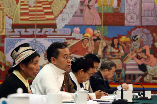Phurbu Dondrub, a deputy to the 13th National People's Congress, speaks at a plenary meeting of the Tibet autonomous region's delegation to the top legislature's annual session in Beijing on Thursday. (Photo by Wang Zhuangfei/China Daily)
