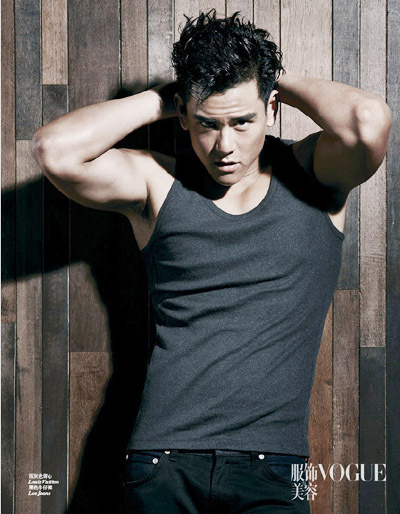 Chinese actor Eddie Peng Yuyan poses during a photoshoot for the August issue of VOGUE. [Photo provided to China Daily]