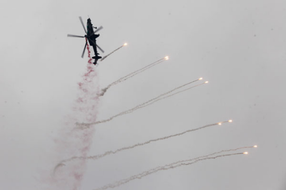 A helicopter performs during the Second China Helicopter Exposition in the northern city of Tianjin, Sept 5, 2013. [Photo/Asianewsphoto]