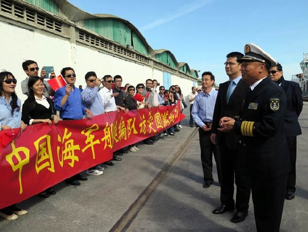 The photo shows that Sr. Capt. Li Pengcheng, commander of the 16th Chinese naval escort taskforce, bids farewell to overseas Chinese and Chinese nationals at the Port La Goulette, Tunisia. The 16th naval escort taskforce under the Navy of the Chinese Peoples Liberation Army (PLAN) concluded its three-day-long goodwill visit to Tunisia and set off for Senegal on May 7, 2014. (Xinhua/Pan Xiaojing)